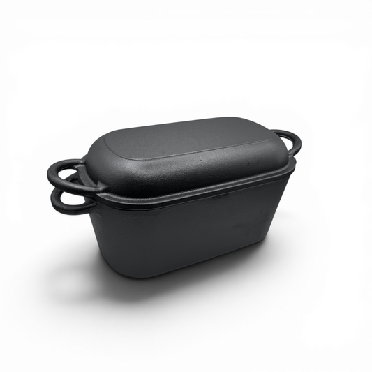 Black rectangular baking dish with a lid on a white background