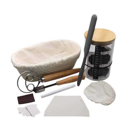 Sourdough master kit with glass jar, plastic scraper, cloth lid, 25cm oval banneton, Danish dough whisk, bread lame, white marker, and metal blades
