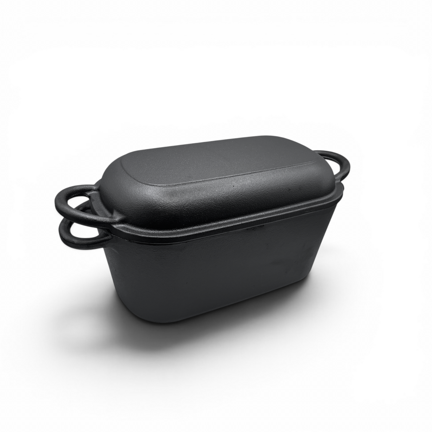 Black rectangular baking dish with a lid on a white background