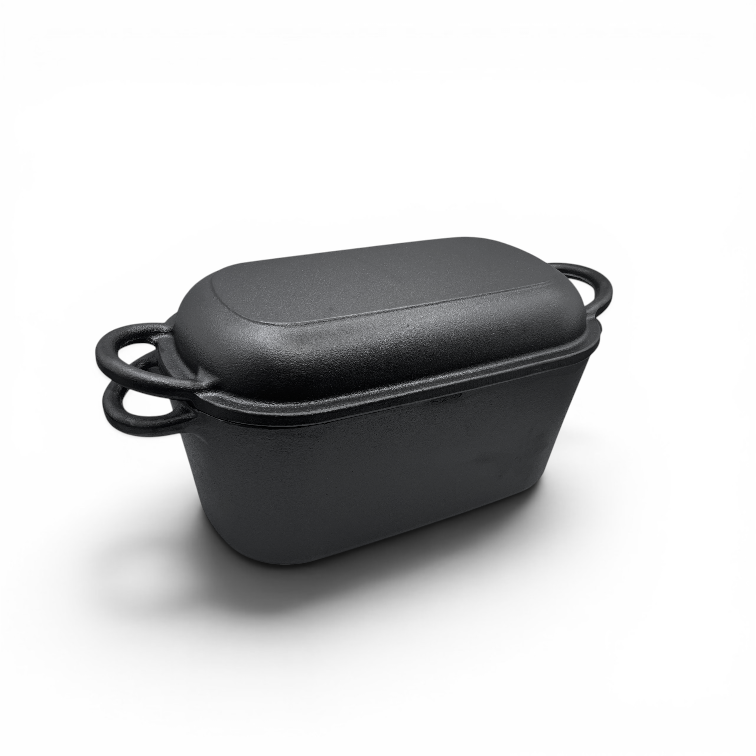 Black rectangular baking dish with a lid on a white background