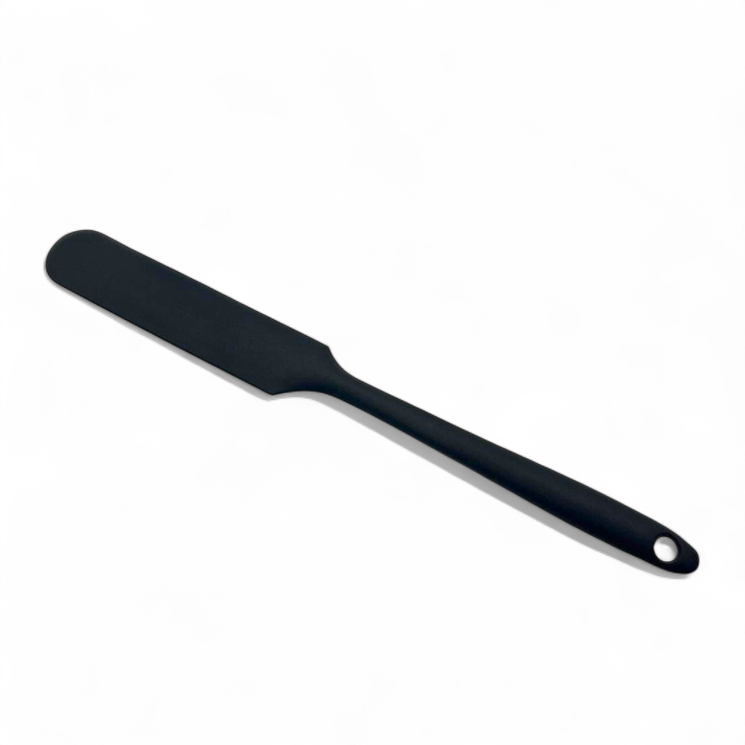 Black silicone spatula on a white background