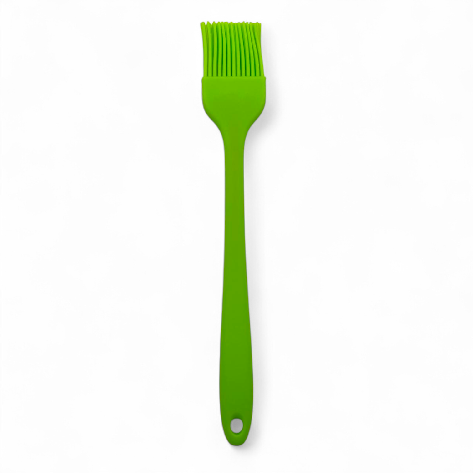 Green silicone basting brush on a white background