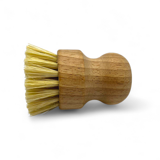 Wooden banneton cleaning brush with bristle head on a white background